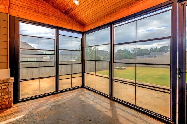 unfurnished sunroom with wood ceiling and vaulted ceiling