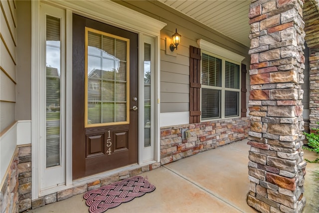 entrance to property featuring a porch