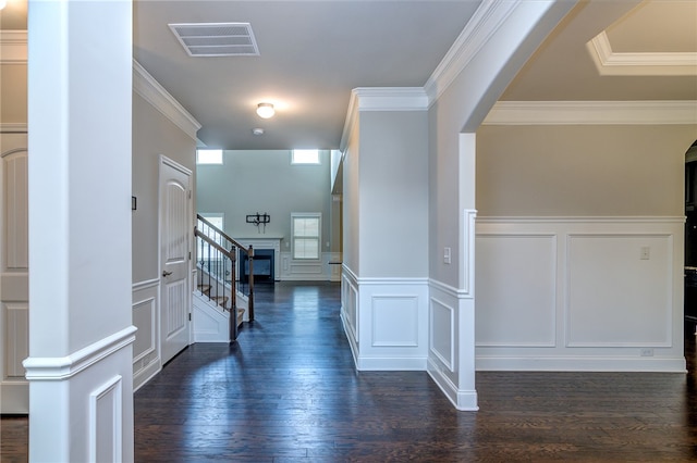 corridor featuring ornamental molding and dark hardwood / wood-style floors