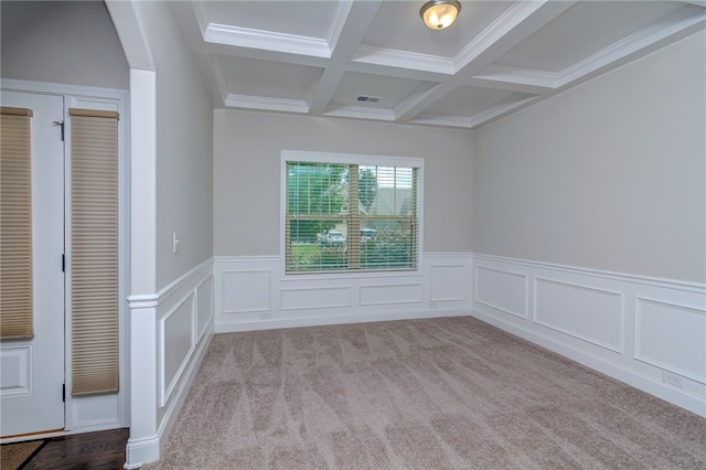 carpeted spare room featuring crown molding, coffered ceiling, and beamed ceiling