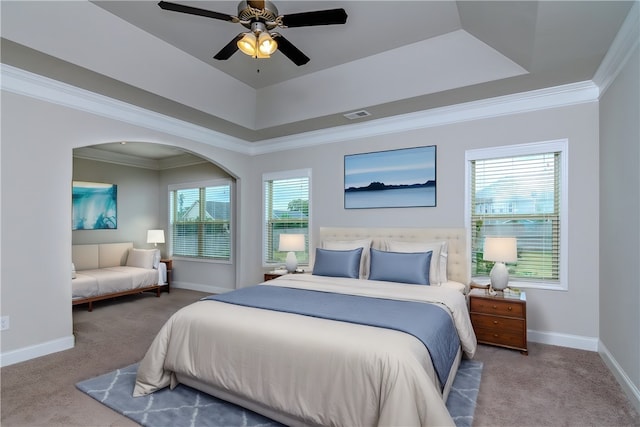 bedroom featuring carpet flooring, ornamental molding, and ceiling fan