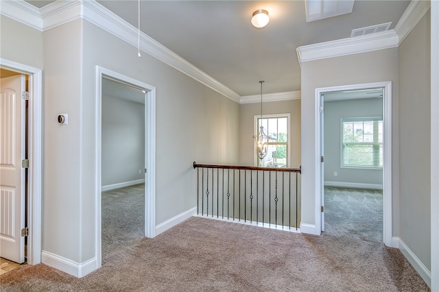 hall with light carpet and crown molding