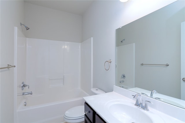 full bathroom featuring tub / shower combination, vanity, and toilet