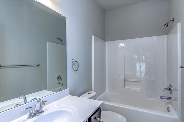 full bathroom featuring shower / washtub combination, vanity, and toilet