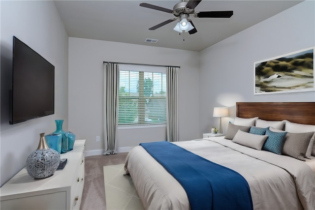 bedroom featuring ceiling fan and light colored carpet