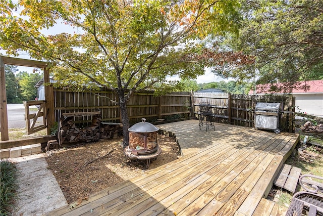 wooden deck with area for grilling