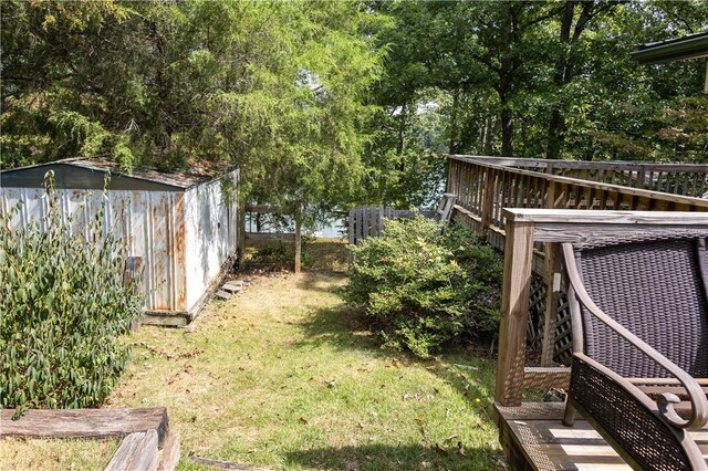 view of yard with a wooden deck