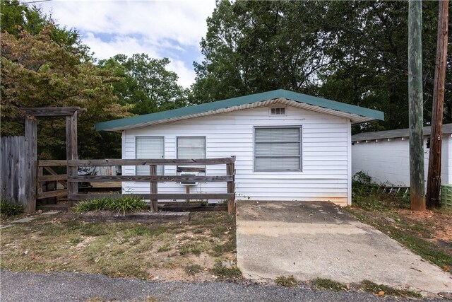 view of front of property with a wooden deck