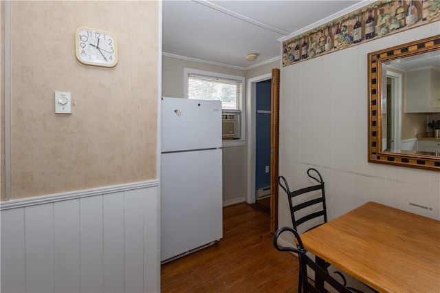 kitchen with ornamental molding, wood-type flooring, white refrigerator, and a baseboard radiator