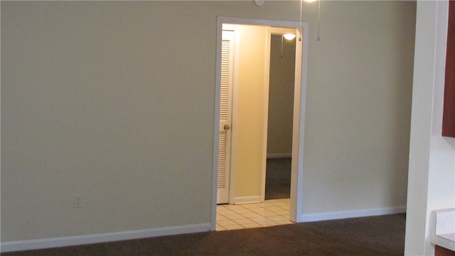 corridor featuring light tile patterned floors