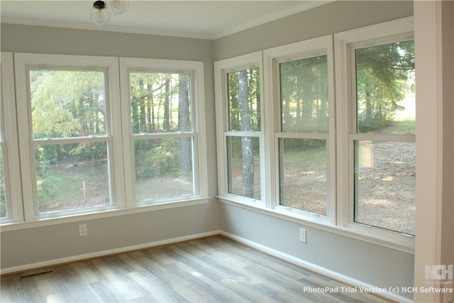 unfurnished sunroom with a wealth of natural light