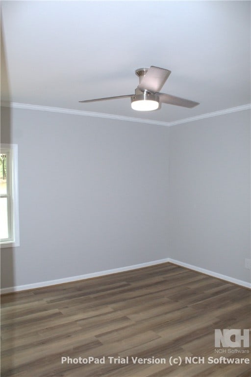 spare room with ceiling fan, dark hardwood / wood-style flooring, and ornamental molding