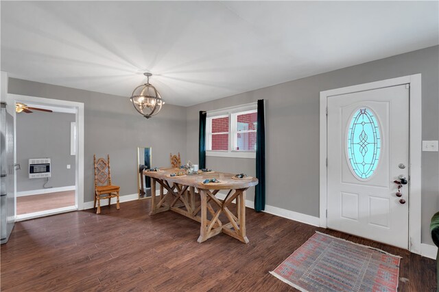 entryway featuring a healthy amount of sunlight, dark hardwood / wood-style flooring, and heating unit