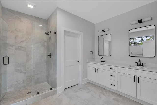 bathroom with walk in shower and vanity