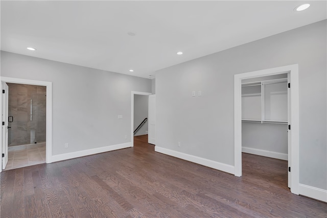 empty room with dark hardwood / wood-style flooring