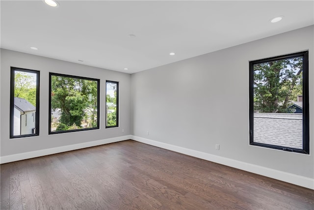 spare room with hardwood / wood-style flooring