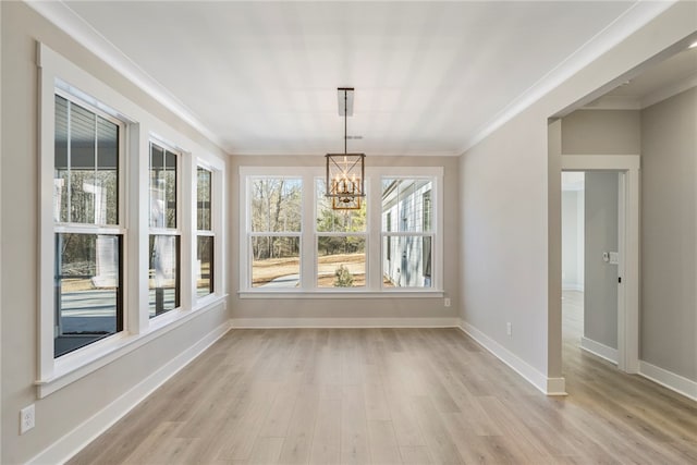 unfurnished sunroom with a chandelier