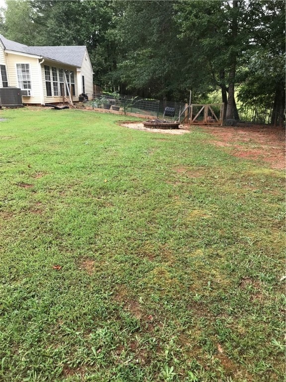 view of yard featuring central air condition unit