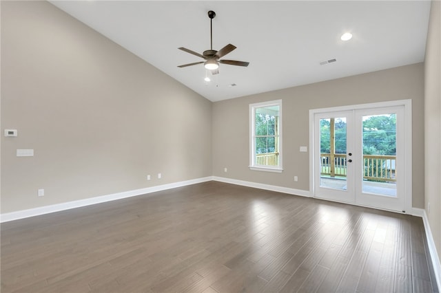 empty room featuring ceiling fan, lofted ceiling, dark hardwood / wood-style floors, and french doors