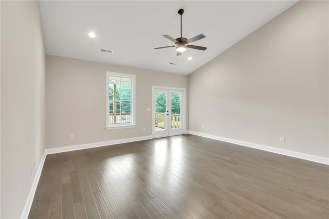 unfurnished room with ceiling fan, lofted ceiling, dark hardwood / wood-style floors, and french doors