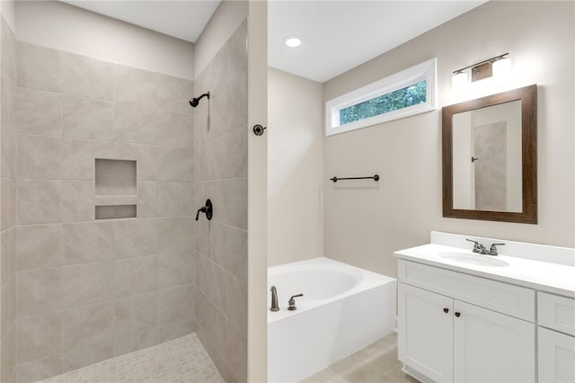 bathroom featuring vanity and separate shower and tub