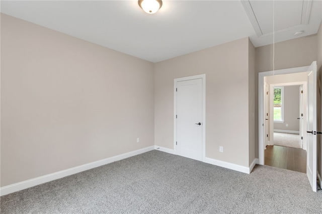 unfurnished bedroom with a closet and carpet flooring