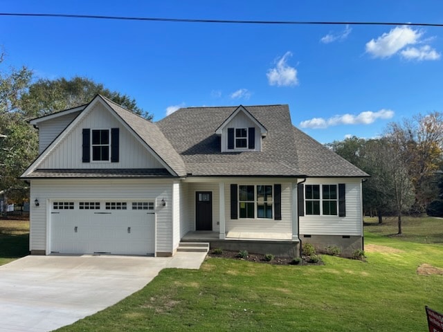 view of front facade with a garage and a front yard