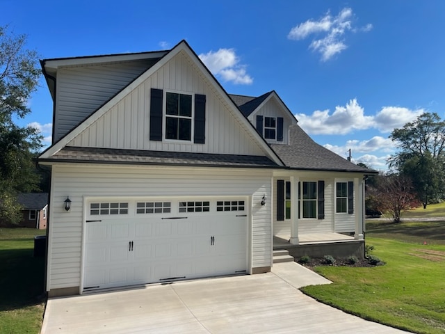 view of front of property with a garage and a front yard