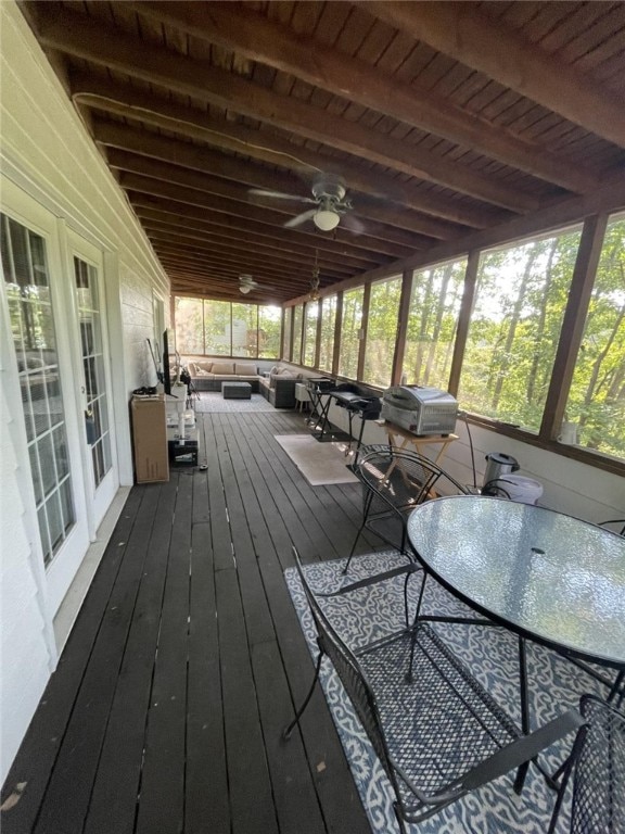 wooden deck with ceiling fan and an outdoor living space