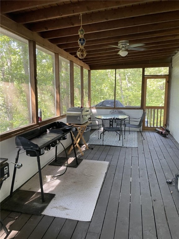 sunroom with ceiling fan and a healthy amount of sunlight