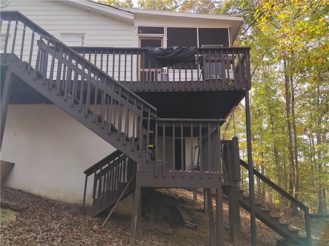 back of house featuring a sunroom