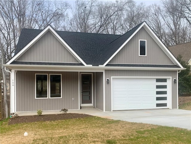 view of front of property featuring driveway, a garage, a porch, roof with shingles, and a front lawn