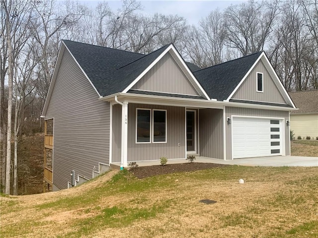 view of front of property featuring a garage, concrete driveway, a porch, roof with shingles, and a front lawn