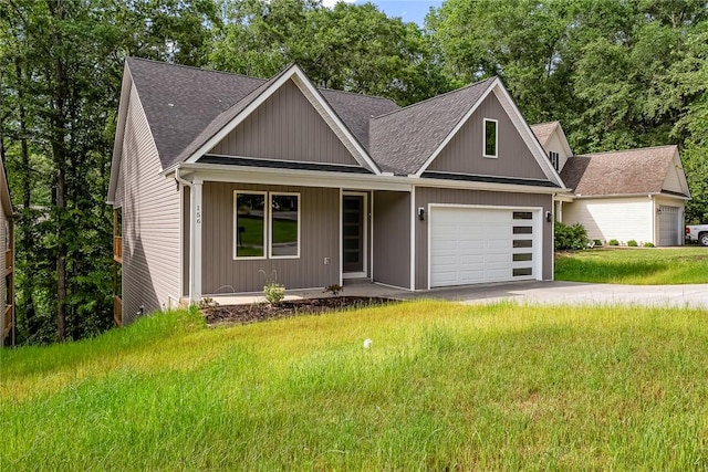 156 Grand Oak Cir, Pendleton, SC 29670 - view of front of house with a porch, a shingled roof, an attached garage, and a front yard