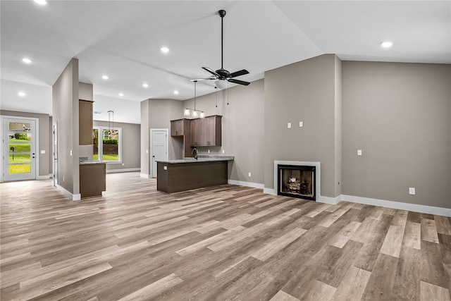 156 Grand Oak Cir, Pendleton, SC 29670 - unfurnished living room with ceiling fan, a sink, light wood-style floors, recessed lighting, and baseboards