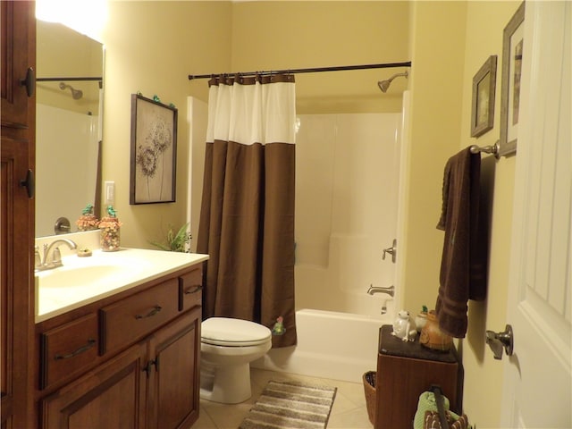 full bathroom featuring tile patterned floors, shower / bath combo, vanity, and toilet