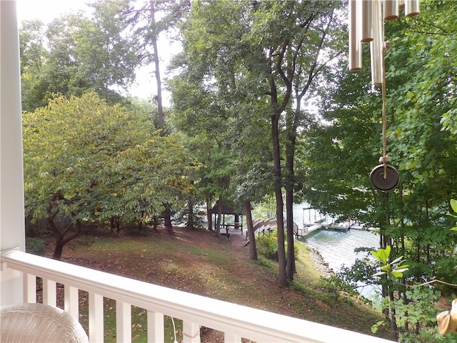 exterior space featuring a water view and a balcony