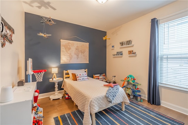 bedroom featuring wood-type flooring