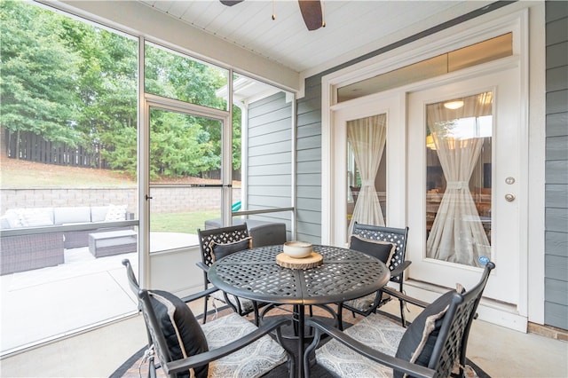 sunroom featuring ceiling fan