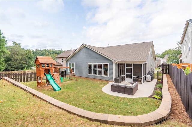 back of property featuring a lawn, a patio, and a playground