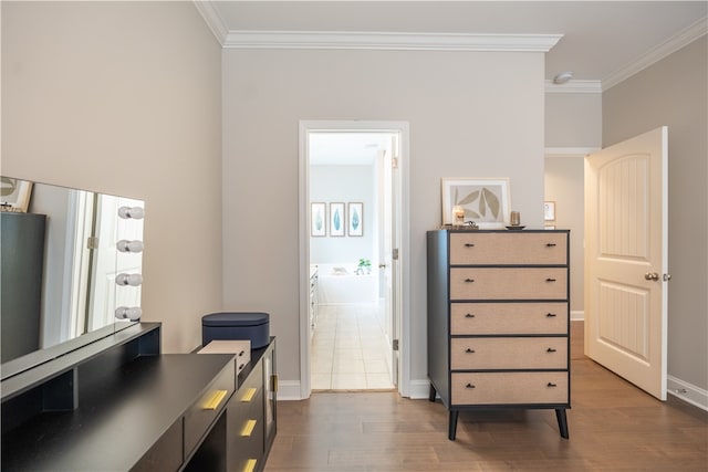 interior space featuring ornamental molding, dark hardwood / wood-style floors, and ensuite bathroom