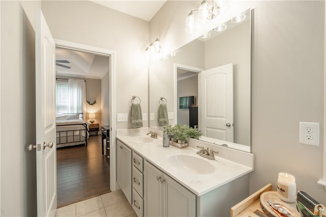 bathroom featuring wood-type flooring, vanity, and ceiling fan