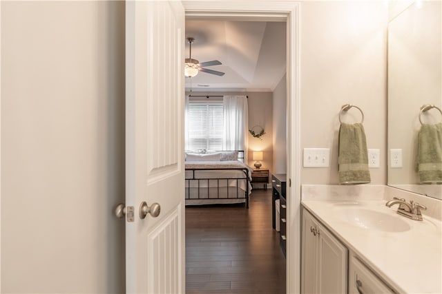 bathroom featuring wood-type flooring, lofted ceiling, vanity, and ceiling fan