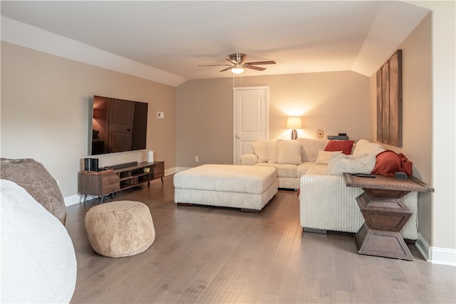 living room with vaulted ceiling, ceiling fan, and hardwood / wood-style flooring