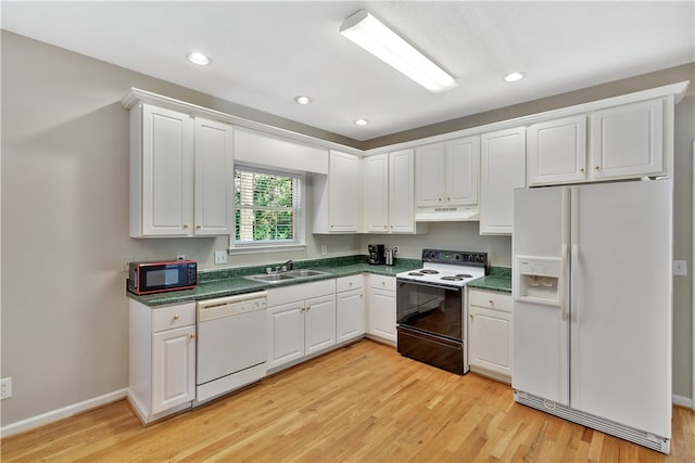 kitchen with sink, light hardwood / wood-style flooring, white cabinetry, and black appliances