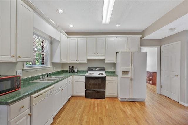 kitchen with light hardwood / wood-style floors, white appliances, sink, and white cabinets