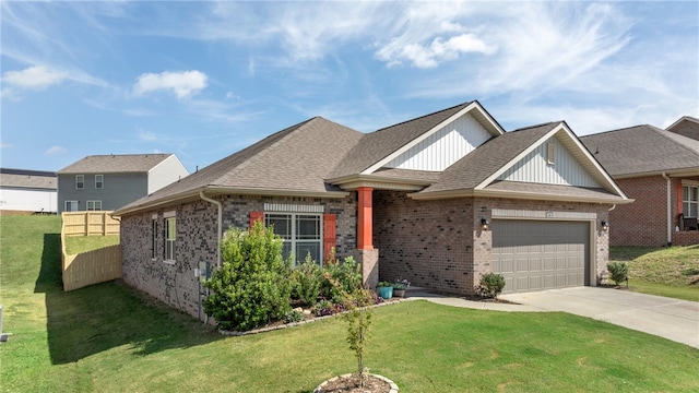 view of front of property featuring a front yard and a garage