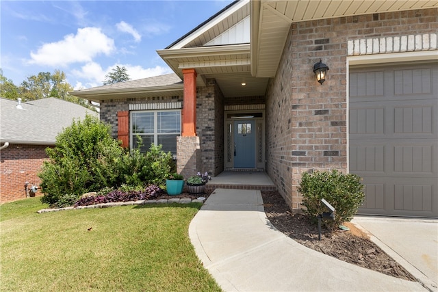 property entrance with a yard and a garage