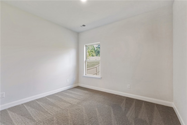 unfurnished room featuring carpet flooring