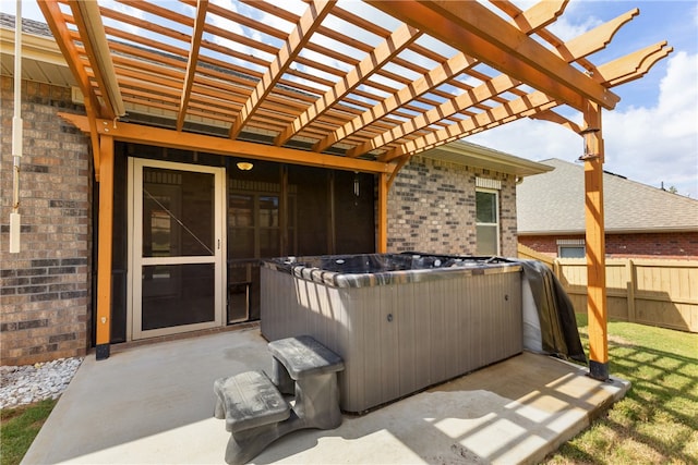 view of patio featuring a hot tub and a pergola